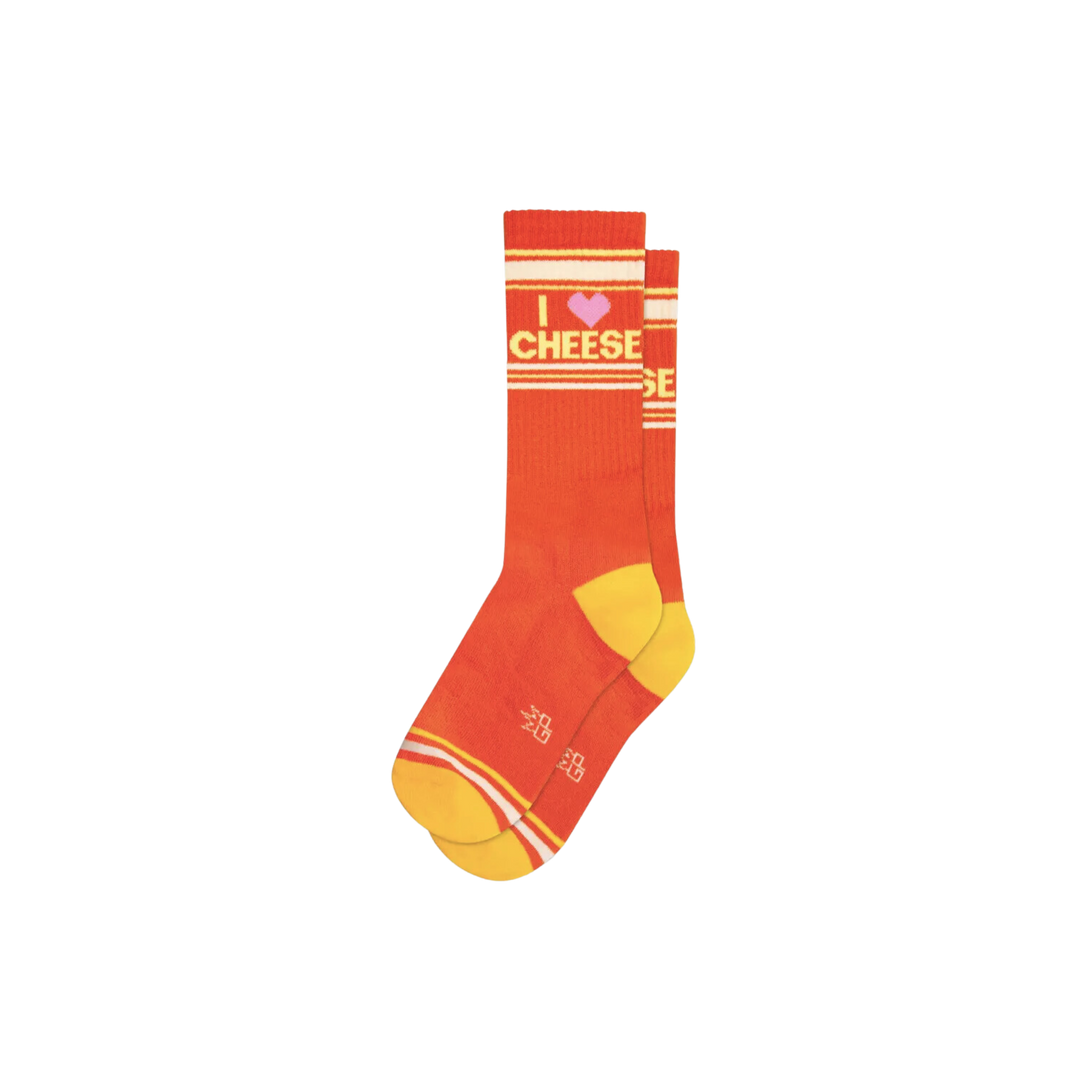 Orange socks with yellow and white stripes and text "I Love Cheese". No matter the preference for cheese, everyone can appreciate the comfy feel of these socks. Crafted with a plush combination of Cotton, Nylon, and Spandex, these USA-made crew socks exude a Pepper Jack-like style that can enhance any outfit. With their one-size-fits-most design, they can be enjoyed by any cheese lover.