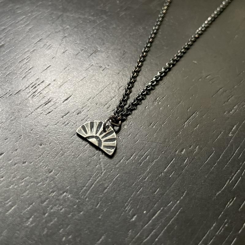 Tiny Silver Sunburst Necklace (downward facing)