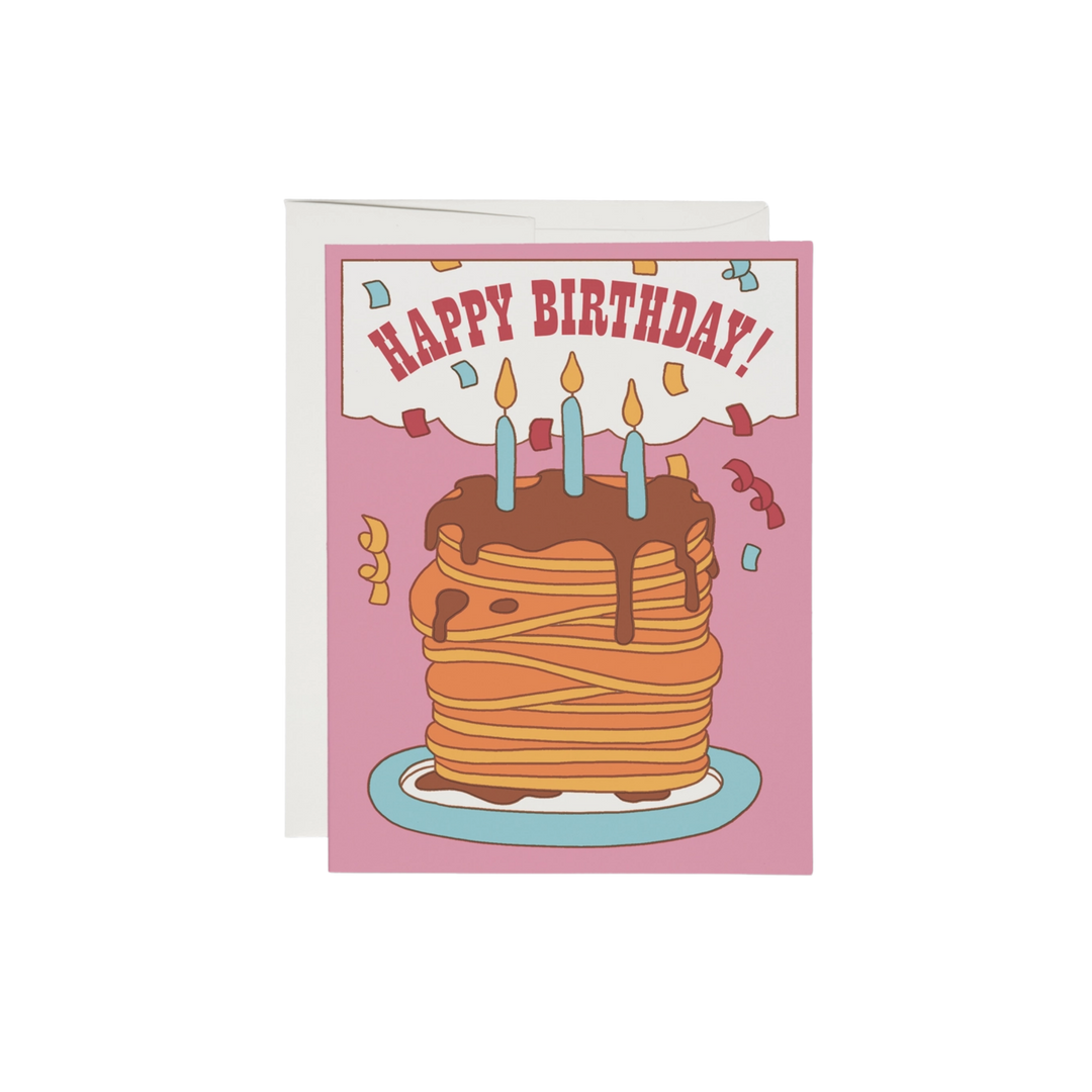Cartoon stack of pancakes with birthday candles on pink background, with text "Happy Birthday!". This birthday card is printed on 100 lb heavyweight card stock, measuring 5.5 x 4.25 inches. The artwork is by Clay Hickson, and it is made in the USA.